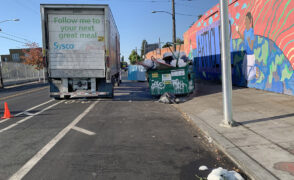 Blocking bike lane, street and garbage overflow